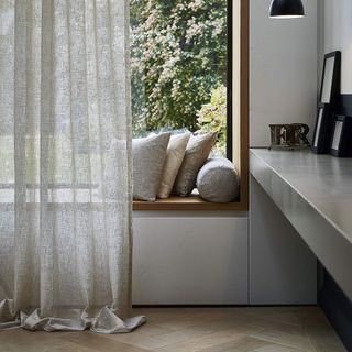 voile curtain with pillows and light