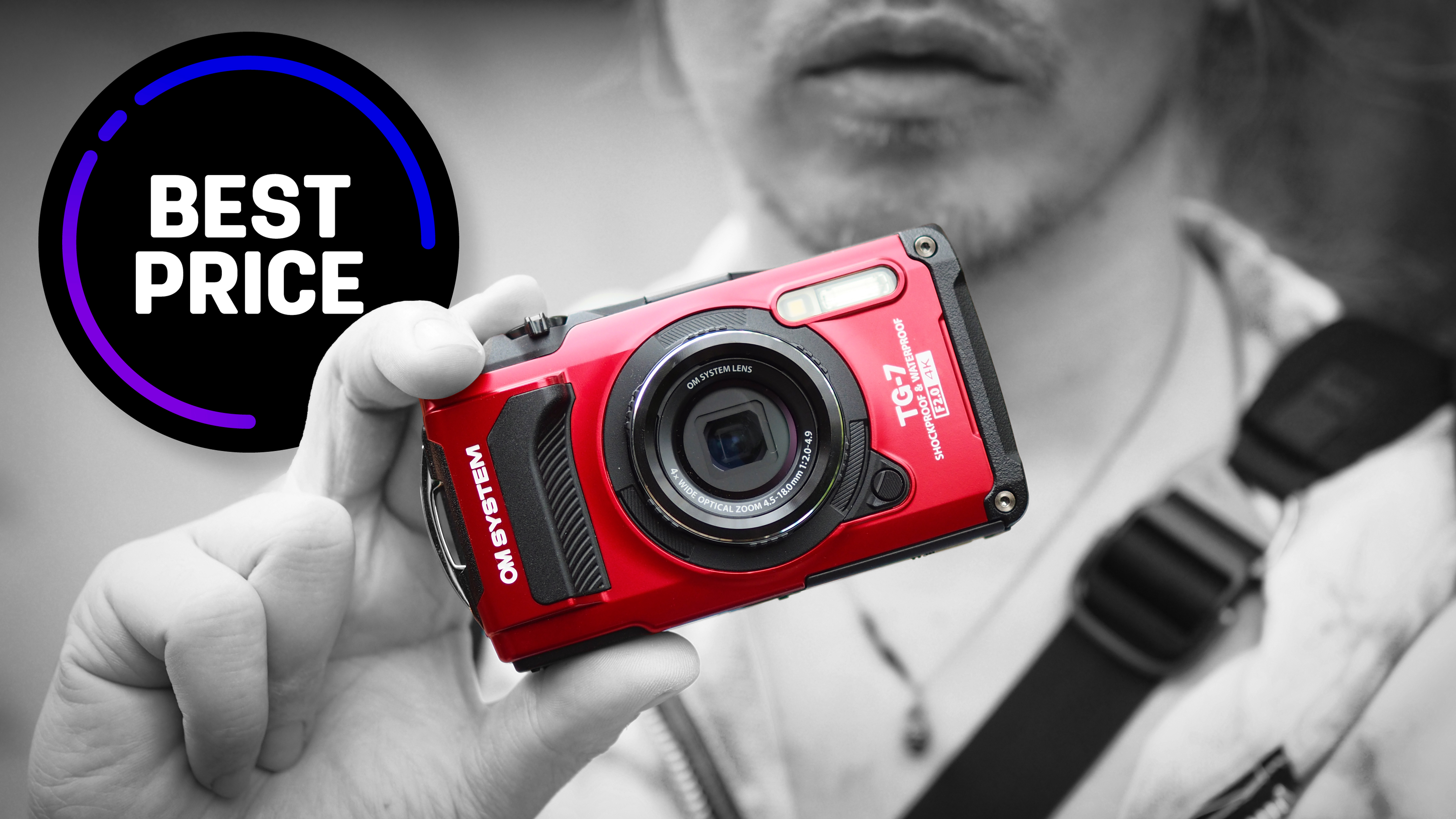 Photographer holding the OM System Tough TG-7, with the text "Best price"