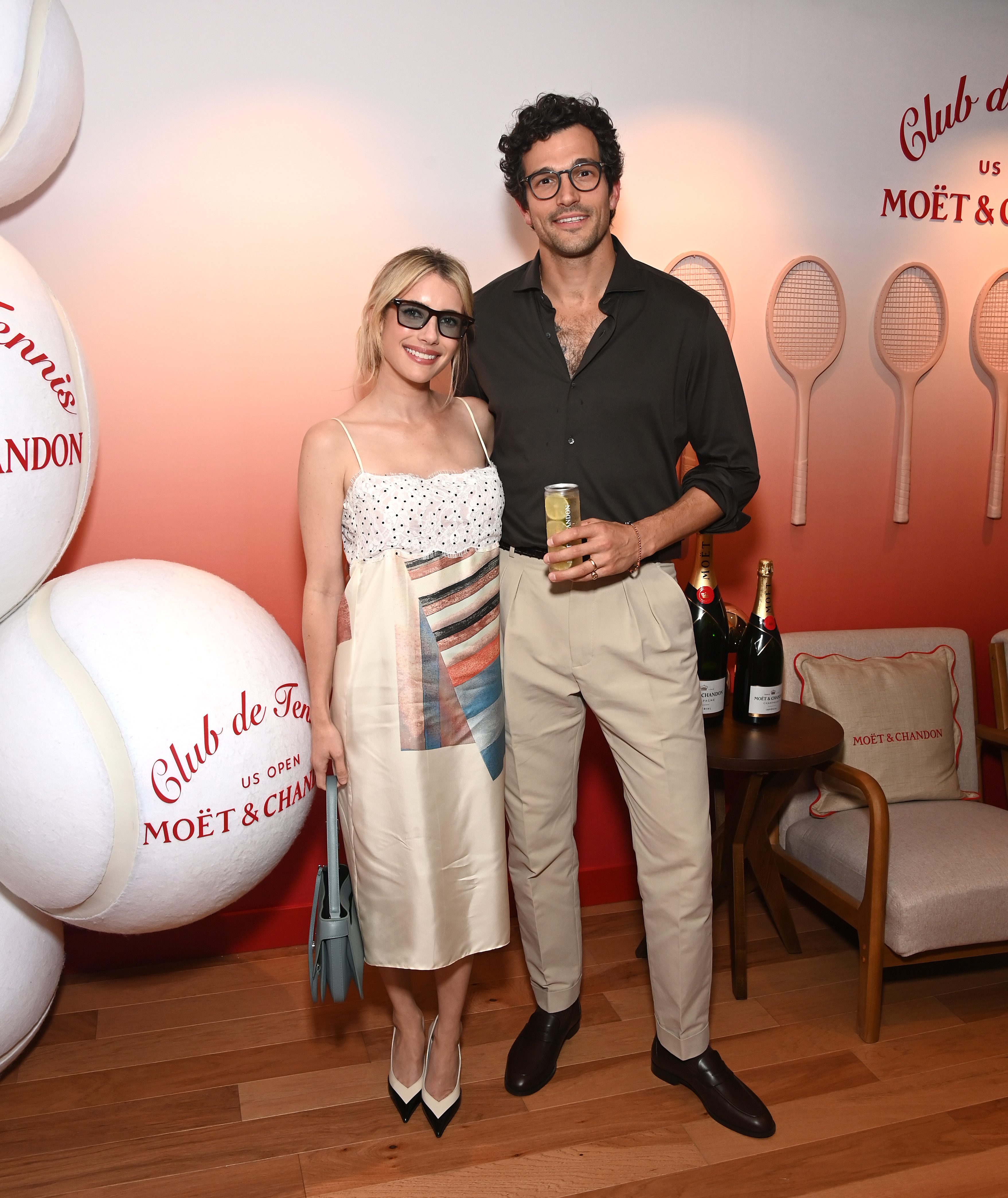 Mo&euml;t &amp; Chandon hosts actors Paul Anthony Kelly and Emma Roberts at the Club de Tennis Suite at the US Open.