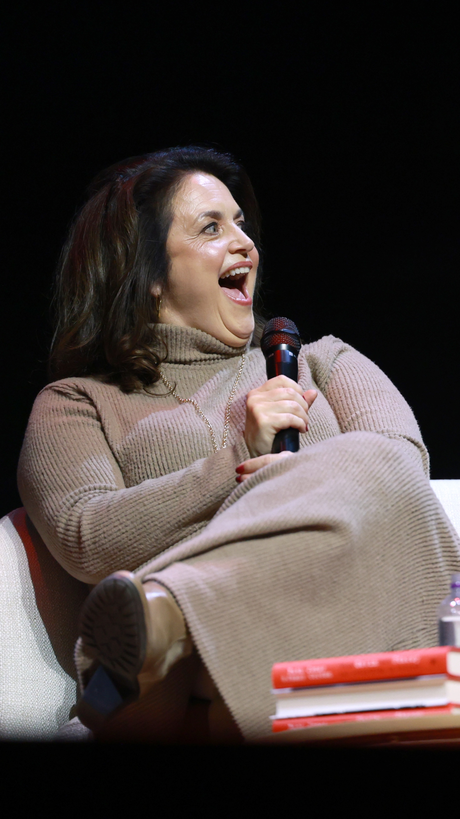Ruth Jones looks at James Corden (not pictured) during the "When Gavin Met Stacey And Everything In Between" book event at London Palladium on October 06, 2025