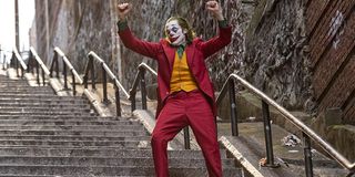 Joker dancing on the stone stairway