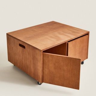 A wooden storage table on wheels that's a part of Zara Home's summer sale.