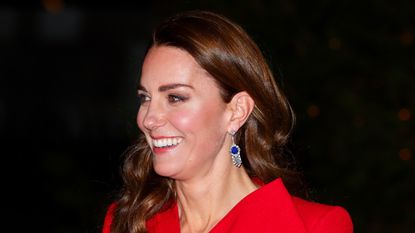 Catherine, Duchess of Cambridge (wearing Queen Elizabeth, The Queen Mother's Sapphire and Diamond Fringe Earrings) attends the 'Together at Christmas' community carol service at Westminster Abbey on December 8, 2021 in London, England. The carol service, hosted and spearheaded by The Duchess of Cambridge, pays tribute to the work of individuals and organisations across the UK who have supported their communities through the COVID-19 pandemic.