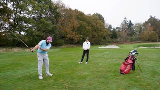 Jess Ratcliffe works on her swing with Zack Bedford