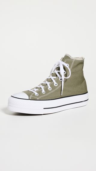 sage green high-top Converse sneakers