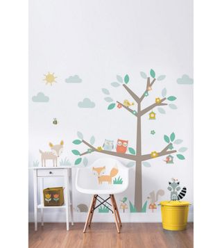 white scheme childrens bedroom with brightly coloured wall stickers from Studio