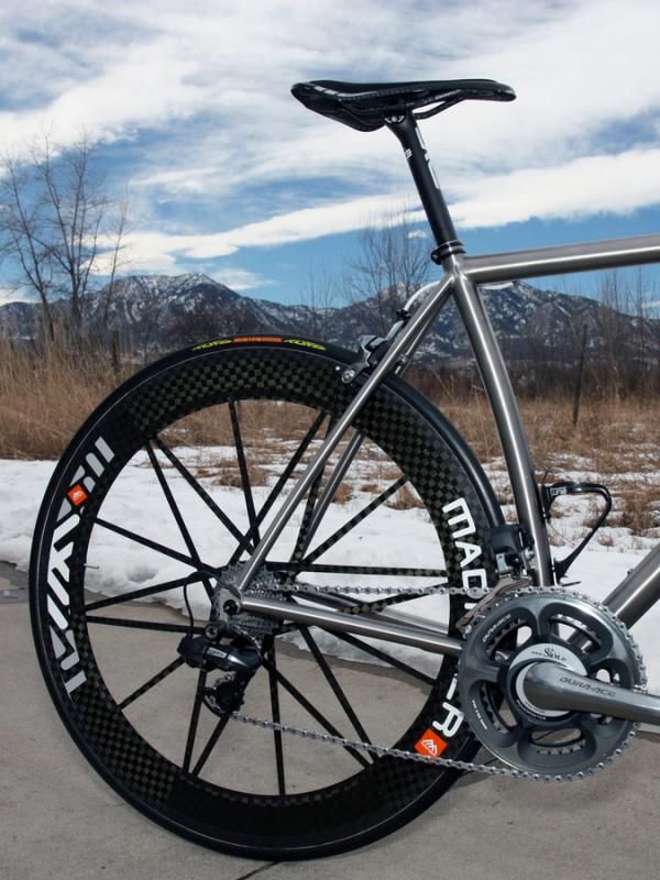 The seat tube and seat stays are gently curved.