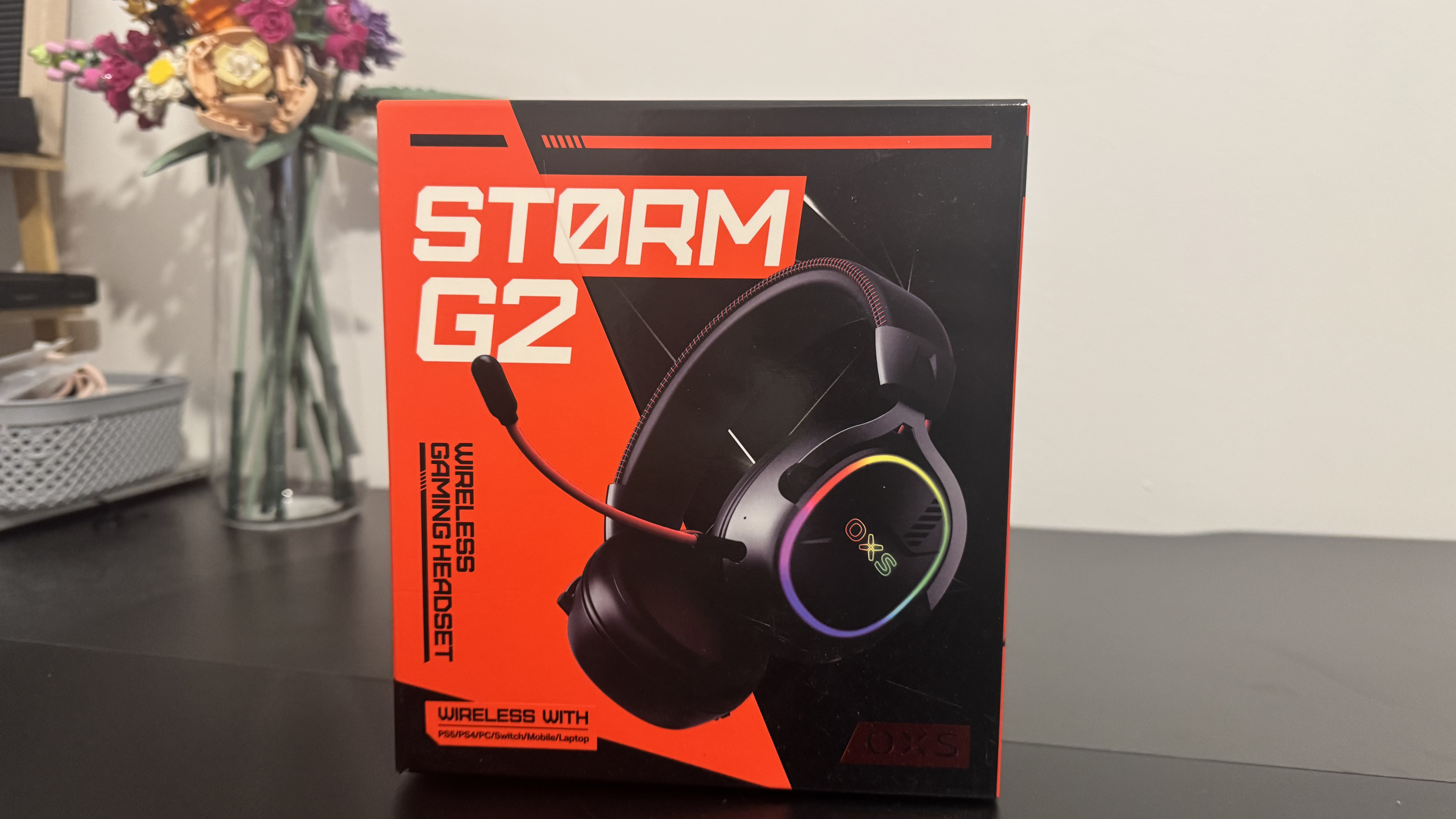 The OXS Storm G2 gaming headset on a black table