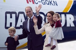 Prince George, Prince William, Princess Katherine and Princess Charlotte outside a plane in Canada