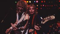 Steve Clark [left] and Phil Collen perform live during Def Leppard's first tour of Japan in 1984.