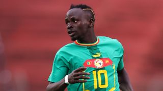 Sadio Mane of Senegal, in bright green jersey with yellow number 10, prepares for AFCON – aka the 2023 Africa Cup of Nations.