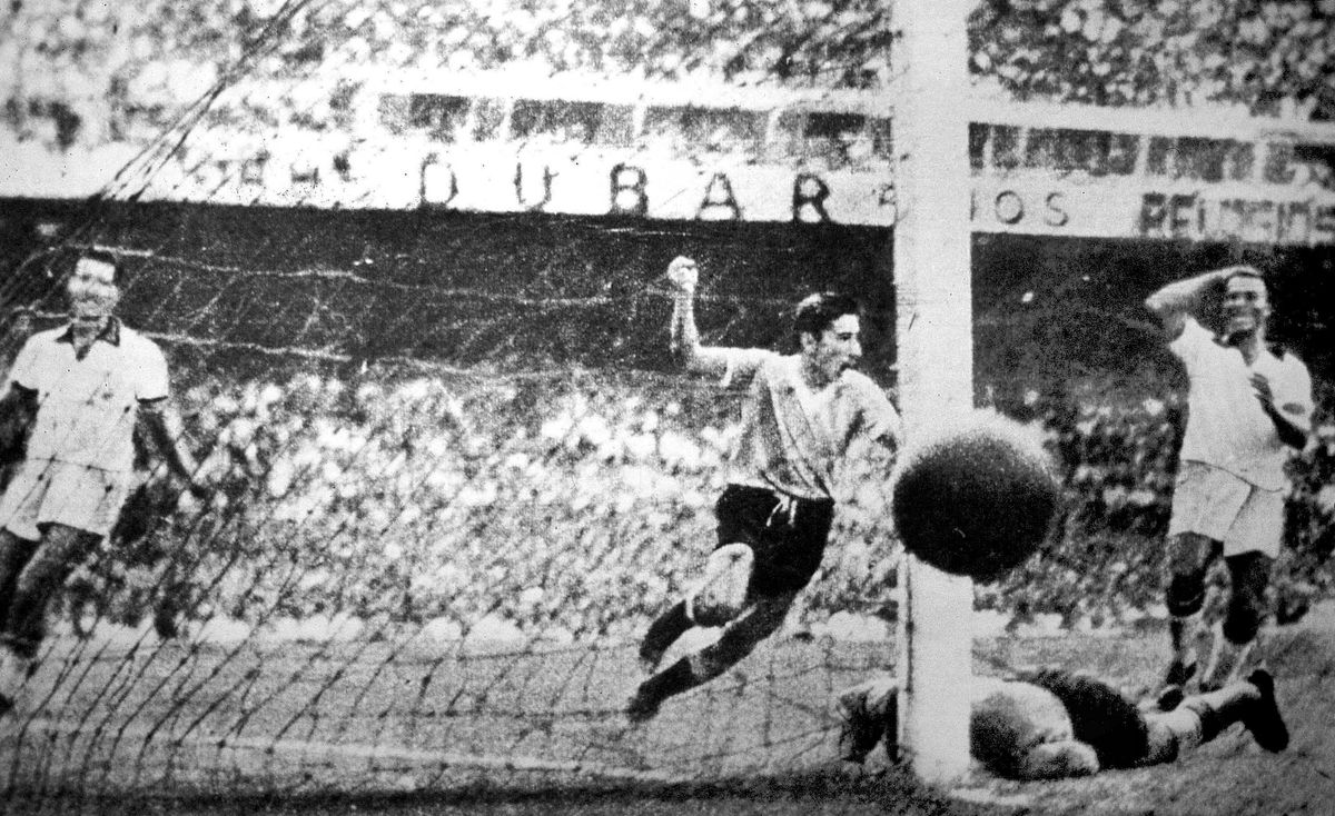 Uruguay's Alcides Ghiggia scores the winning goal against Brazil in the final match of the 1950 World Cup