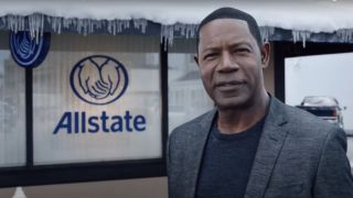 Dennis Haysbert stands in front of an icy Allstate office in Allstate.