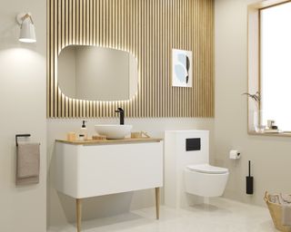 A light bathroom with white vanity and golden accents