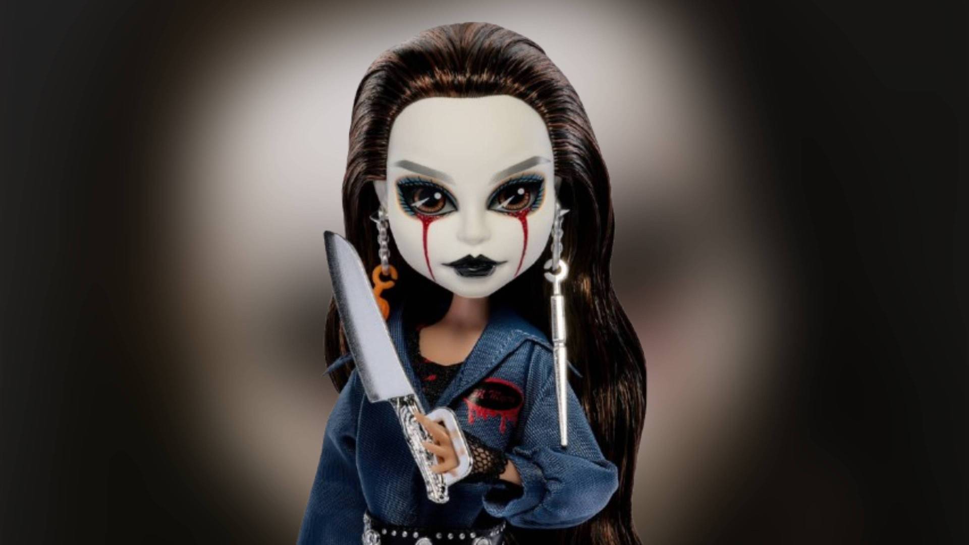 Official image of the Monster High Halloween II Michael Myers doll with a blurred background.