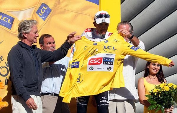 Sastre had all kind of help to get the yellow jersey on.