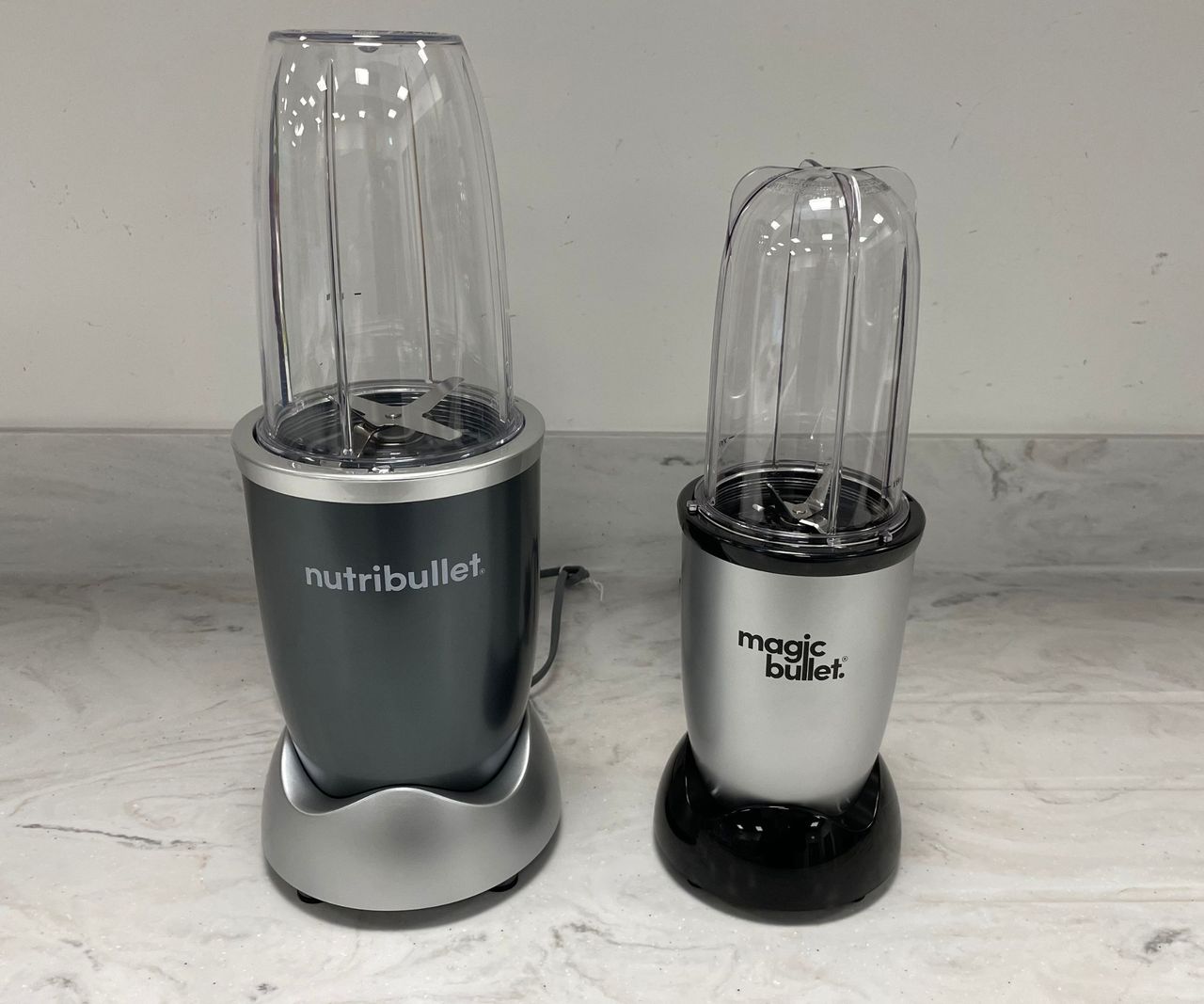 The Magic Bullet Kitchen Express next to the Nutribullet Pro 600 on the counter