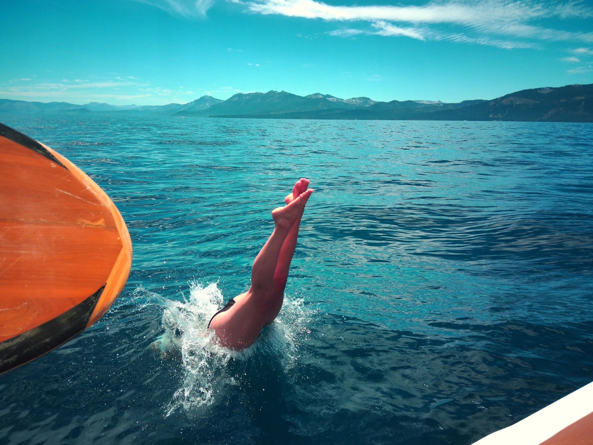 Sample image taken with Portal AFN7 showing a woman's legs diving into blue water