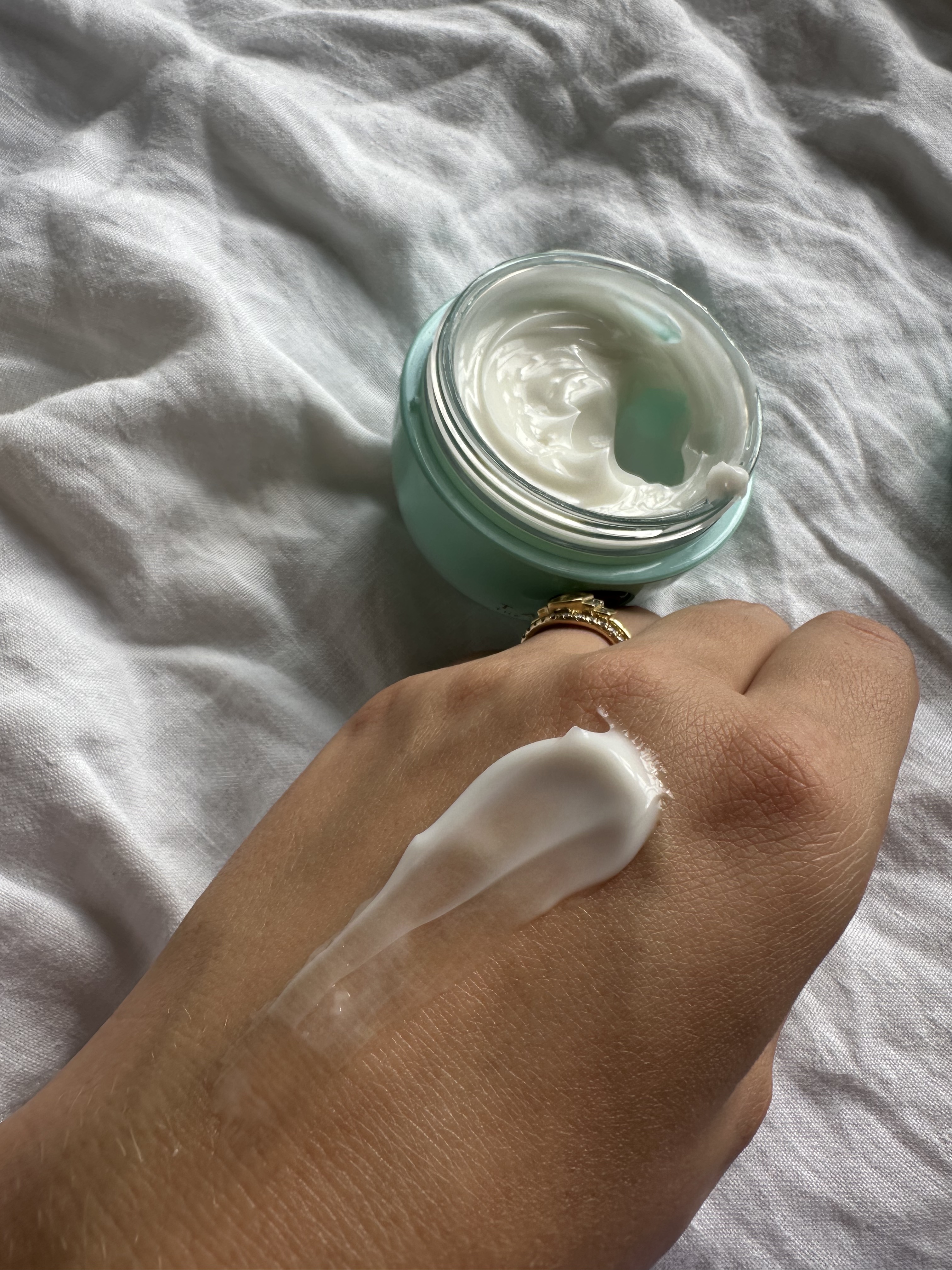 Shannon Lawlor with a swatch of Tatcha The Water Cream on her hand