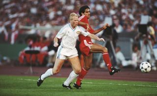 PSV's Ronald Koeman and Benfica's Rui Aguas compete for the ball in the 1988 European Cup final.