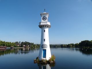 A lighthouse surrounded by water