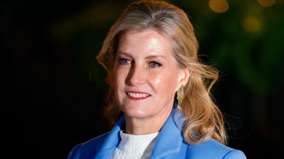 Duchess Sophie wearing gold earrings and a blue blazer
