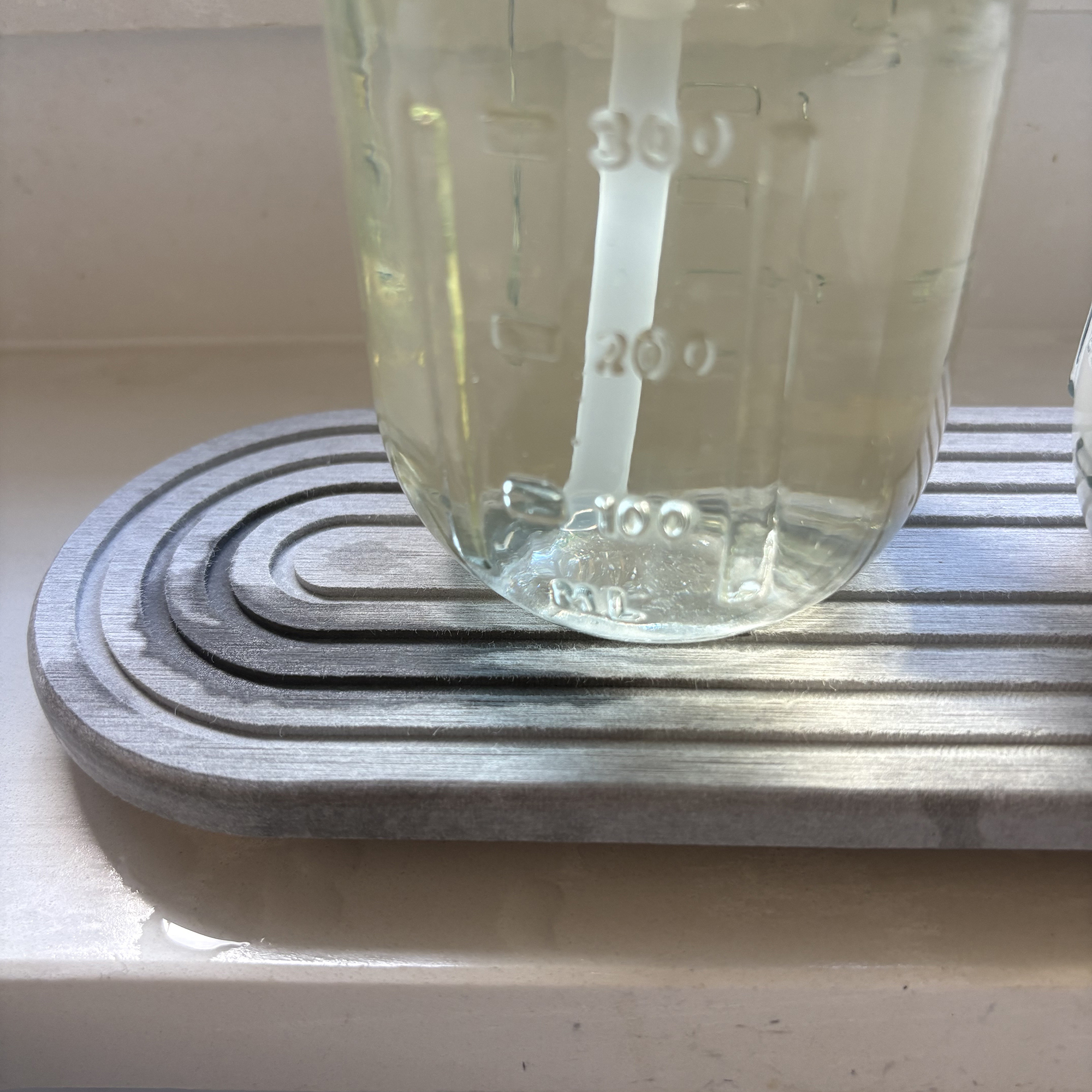 Stone sink caddy in kitchen