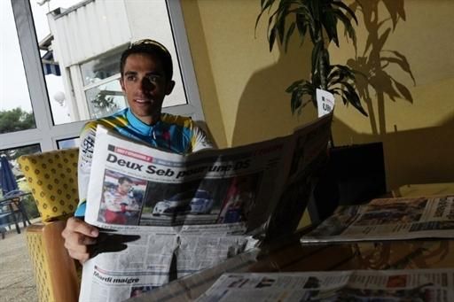 Contador starts his day by reading the newspapers.