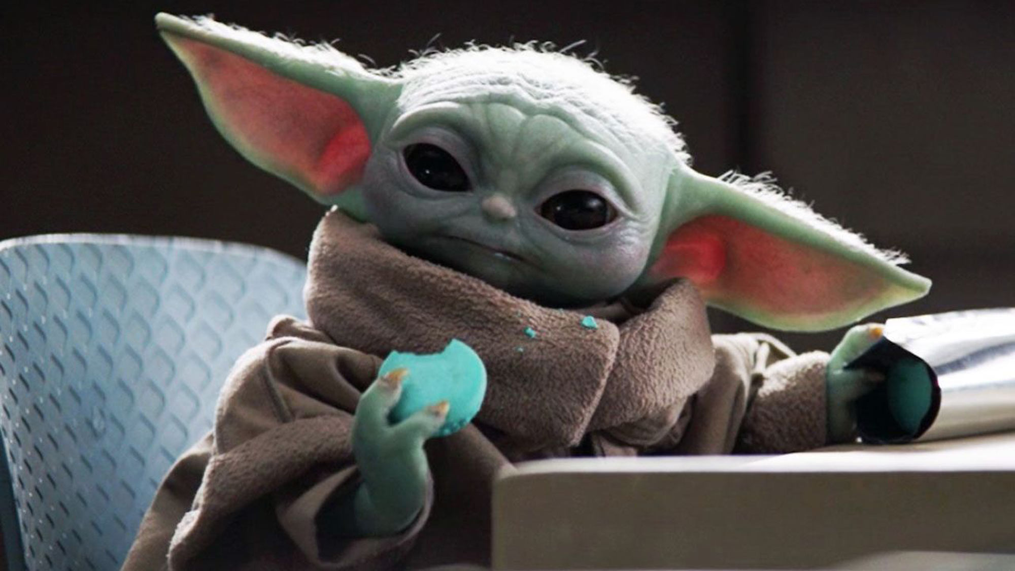 Baby Yoda eats a cookie in The Mandalorian