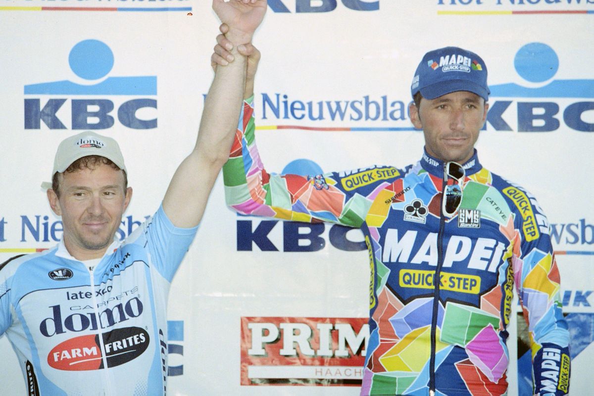 Former teammates Johan Museeuw and Andrea Tafi in 2002