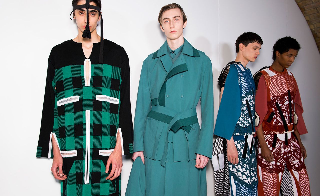 Four male models wearing colourful clothing by Craig Green.