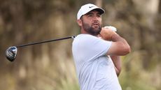 Scottie Scheffler holds his finish on a drive