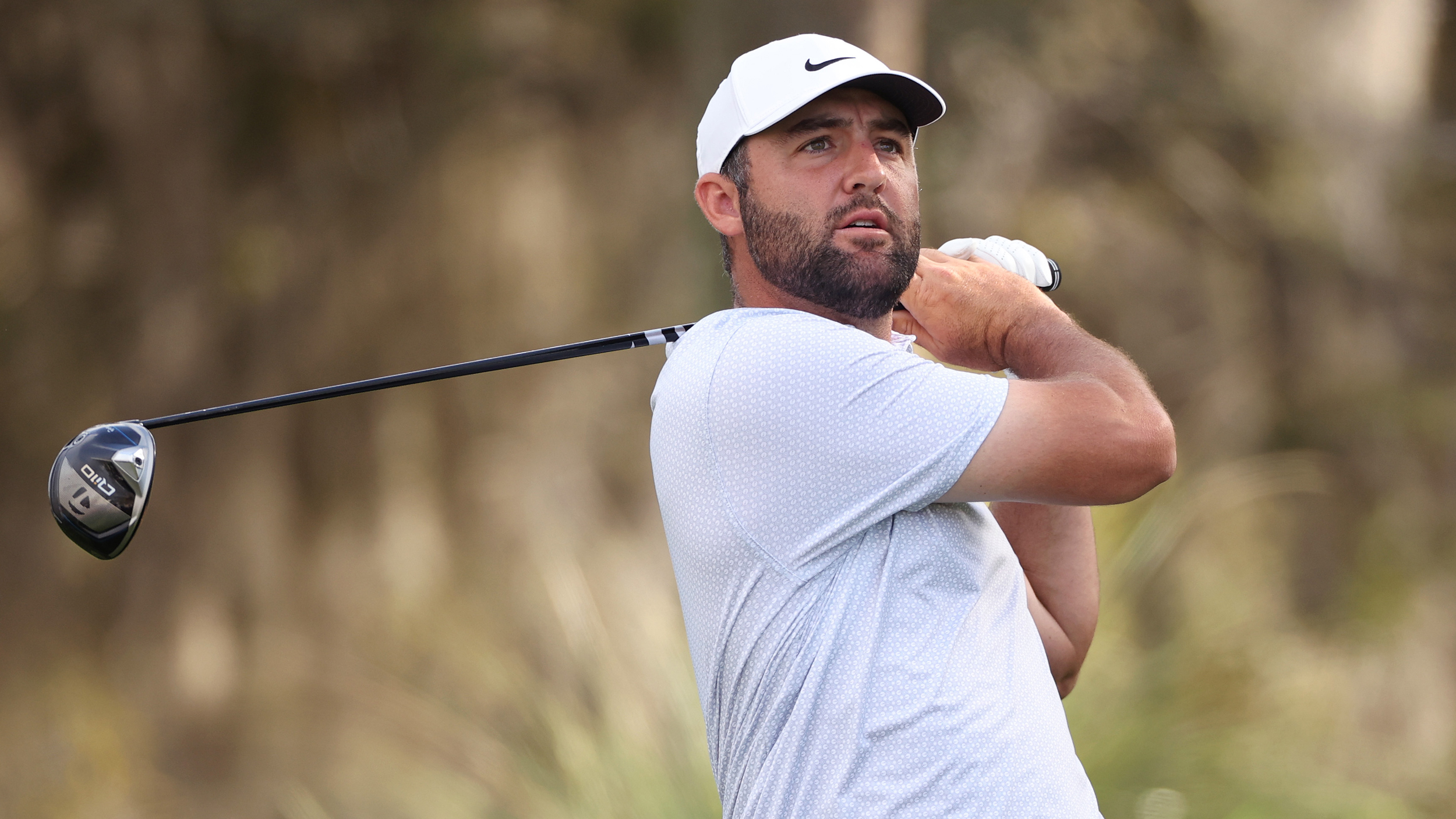 Scottie Scheffler holds his finish on a drive