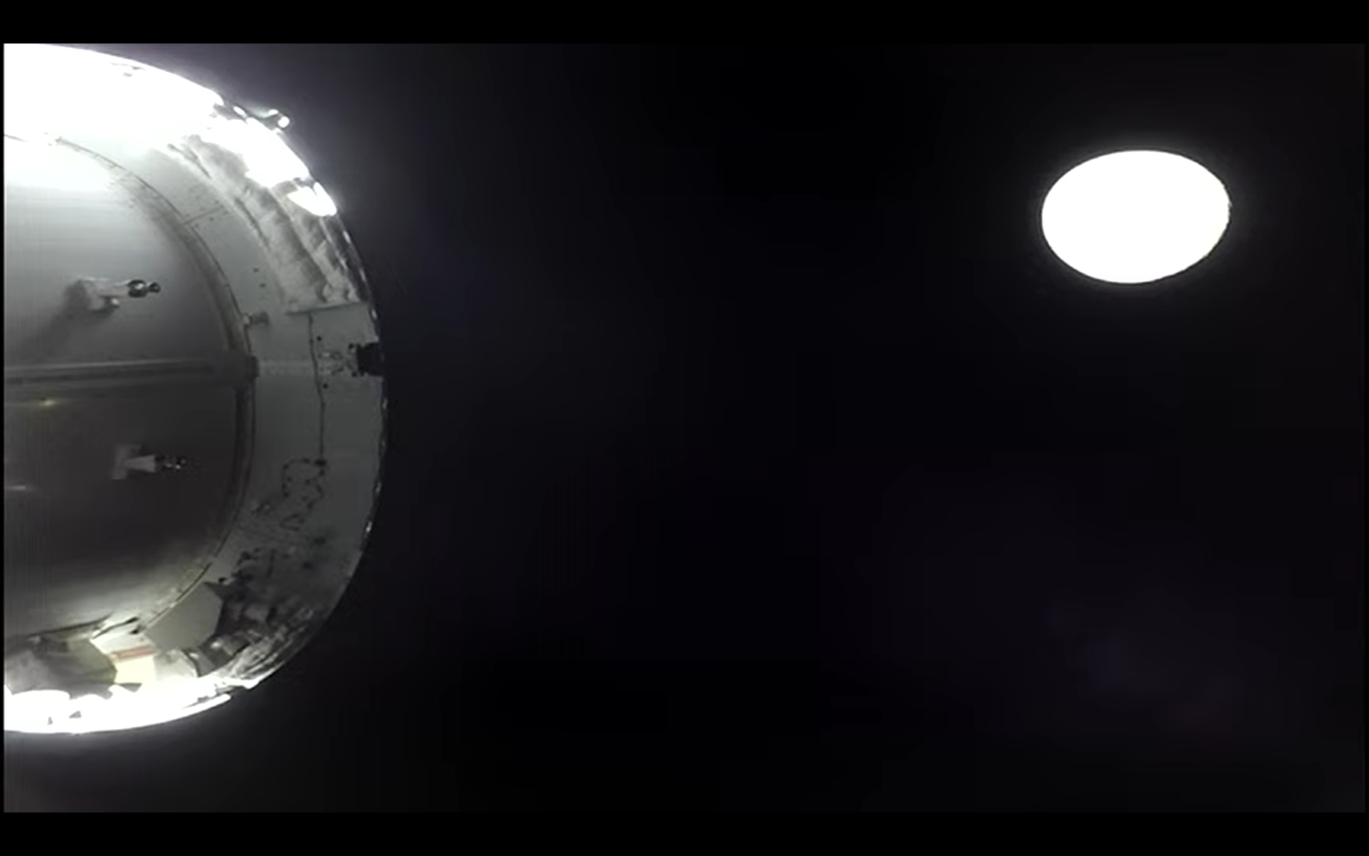 orion spacecraft near bright moon on artemis 2