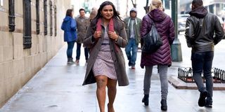 Late Night Mindy Kaling walking on the streets of New York with a smile