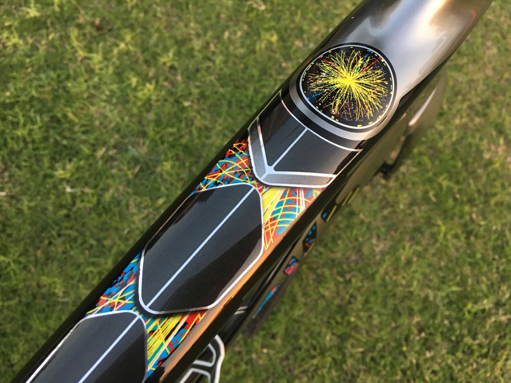 The CERN-inspired graphic on the top tube