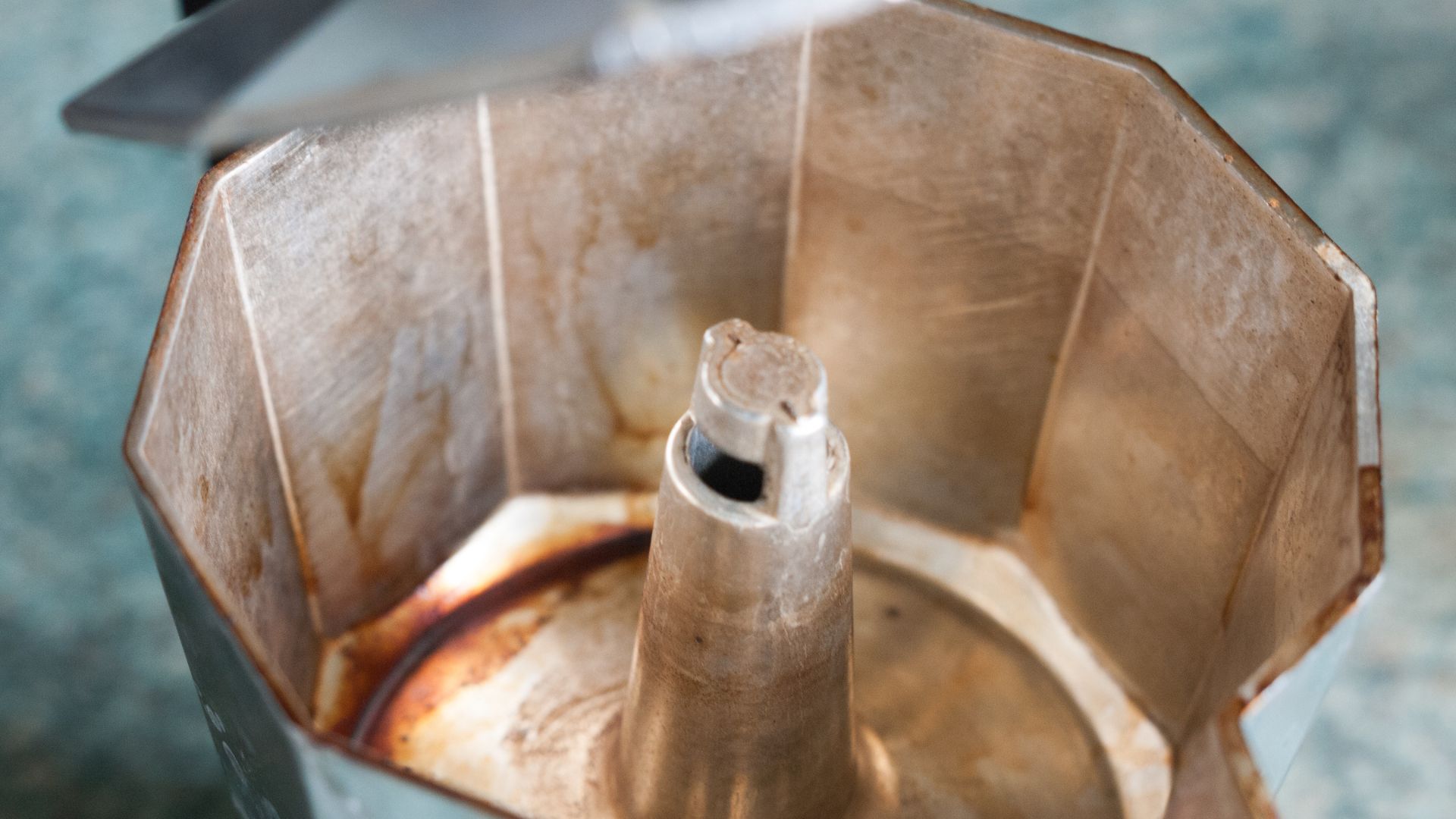 picture of the inside of a moka pot with stains and oxidation