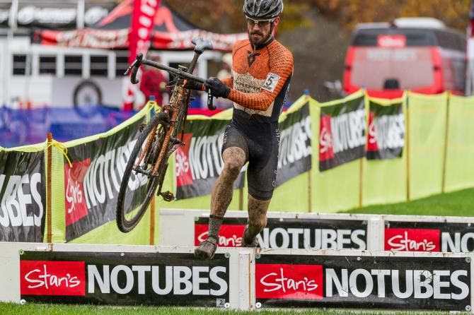 Timmerman flies through the barriers, attempting to reel back Hyde
