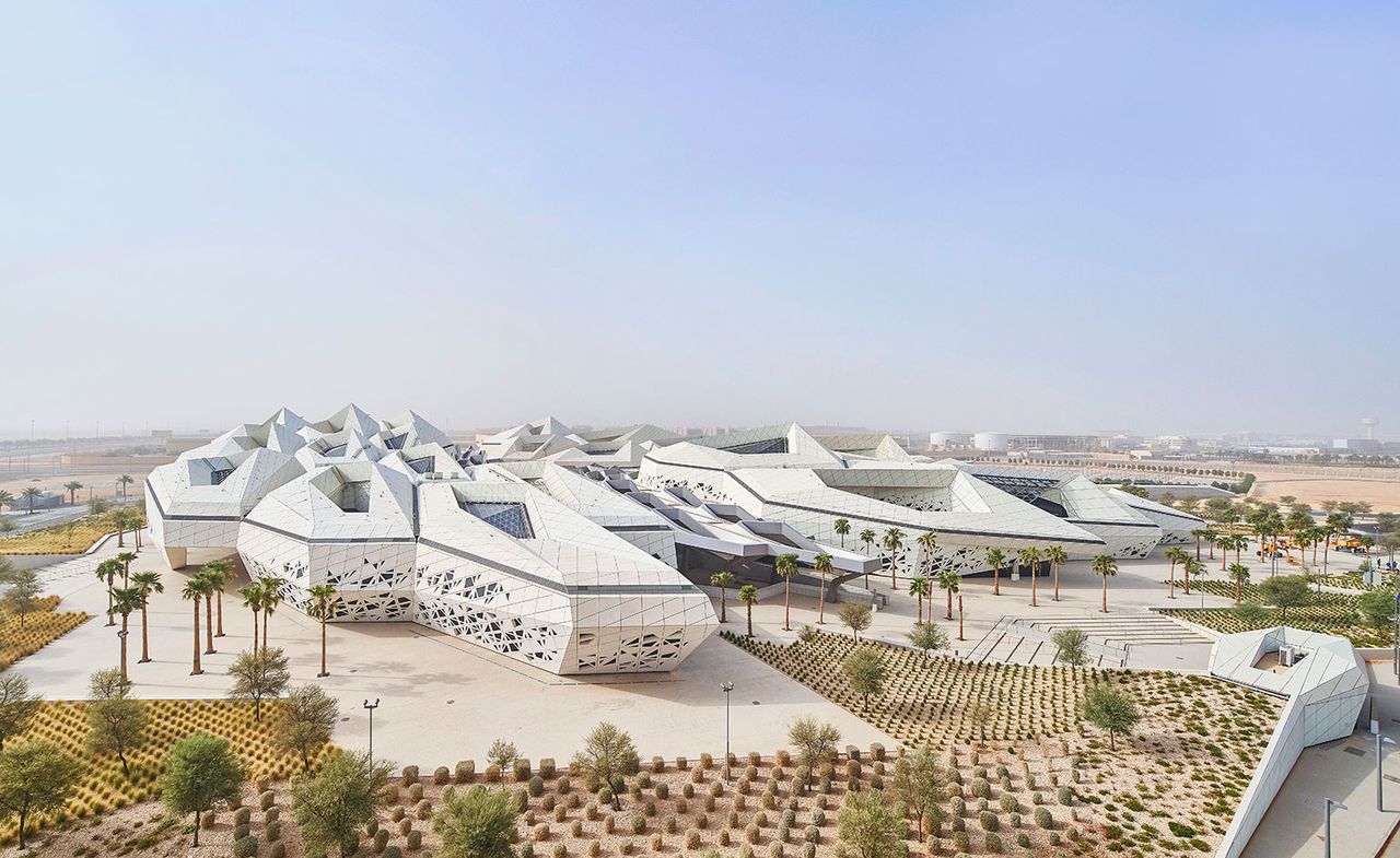 White, futuristic building in a desert setting