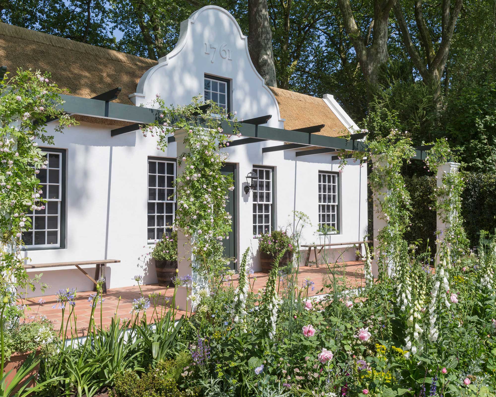 pergola with flowers in 'The Trailfinders South African Wine Estate', designed by Jonathan Snow at RHS Chelsea Flower Show 2018