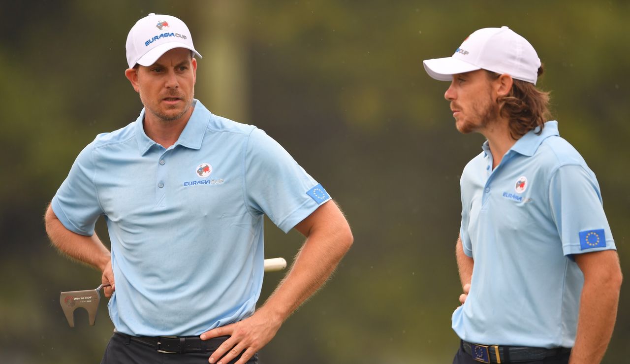 Stenson and Fleetwood talk to each other at the EurAsia Cup