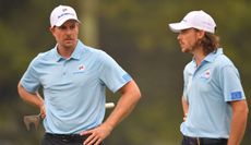 Stenson and Fleetwood talk to each other at the EurAsia Cup