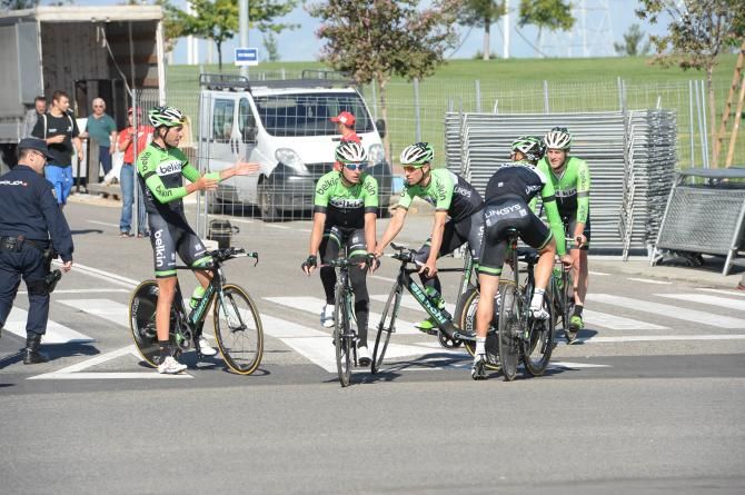 Riders from Team Belkin talk tactics before their training rider