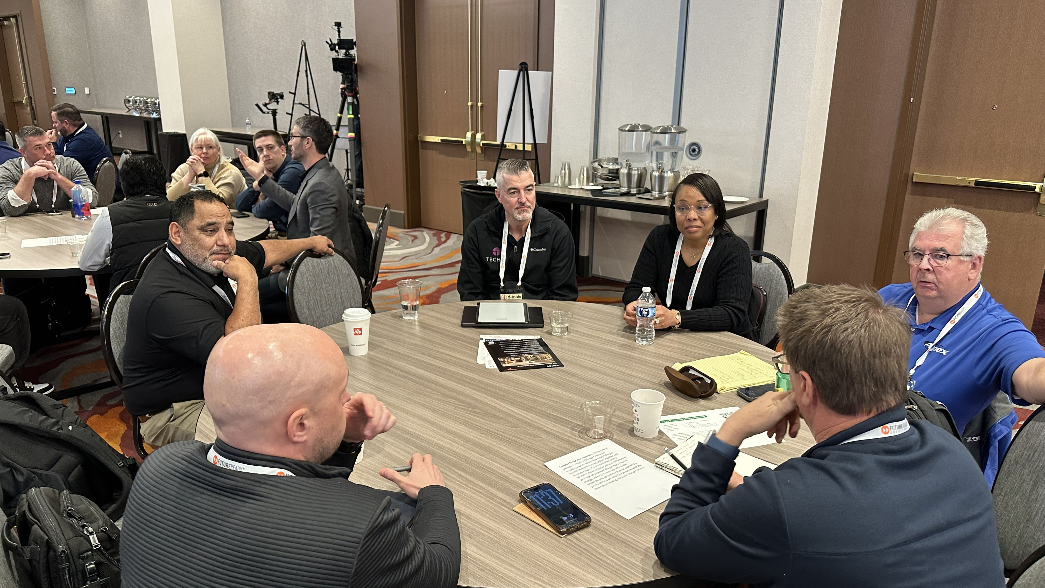 Scenes from D-Tools User Conference including panelists and roundtable discussions.