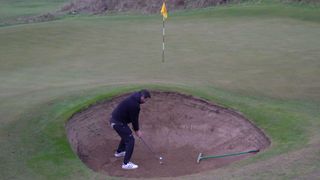 Photo of Joe Ferguson hitting a bunker shot