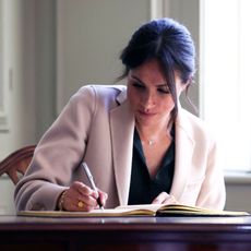 chichester, england october 3 meghan duchess of sussex signs the visitors book at edes house during an official visit to sussex on october 3, 2018 in chichester, england the duke and duchess married on may 19th 2018 in windsor and were conferred the duke duchess of sussex by the queen photo by daniel leal olivas wpa poolgetty images