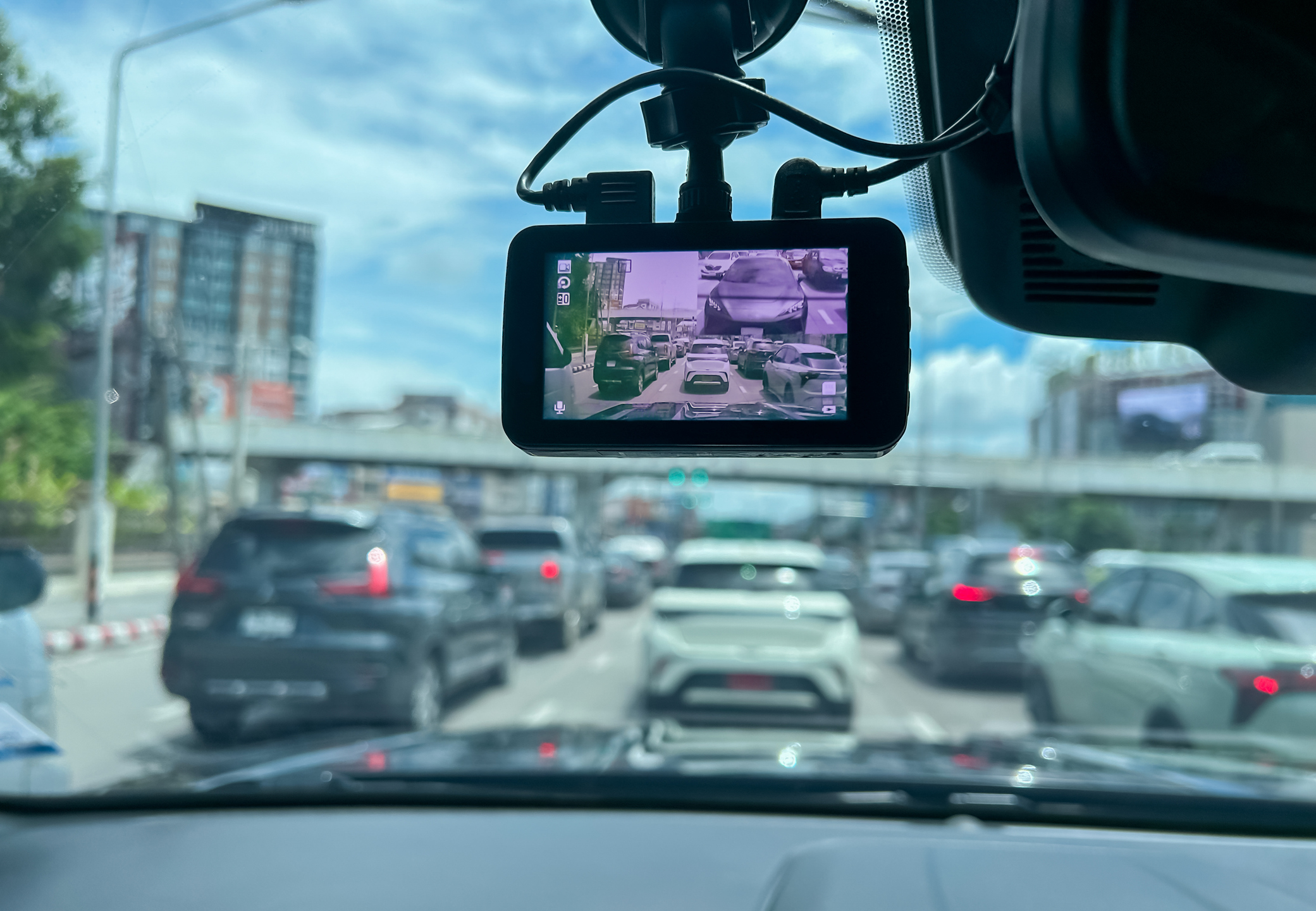 a dash cam displays traffic in front of the car