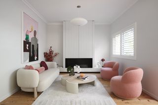 A living room with boucle sofas
