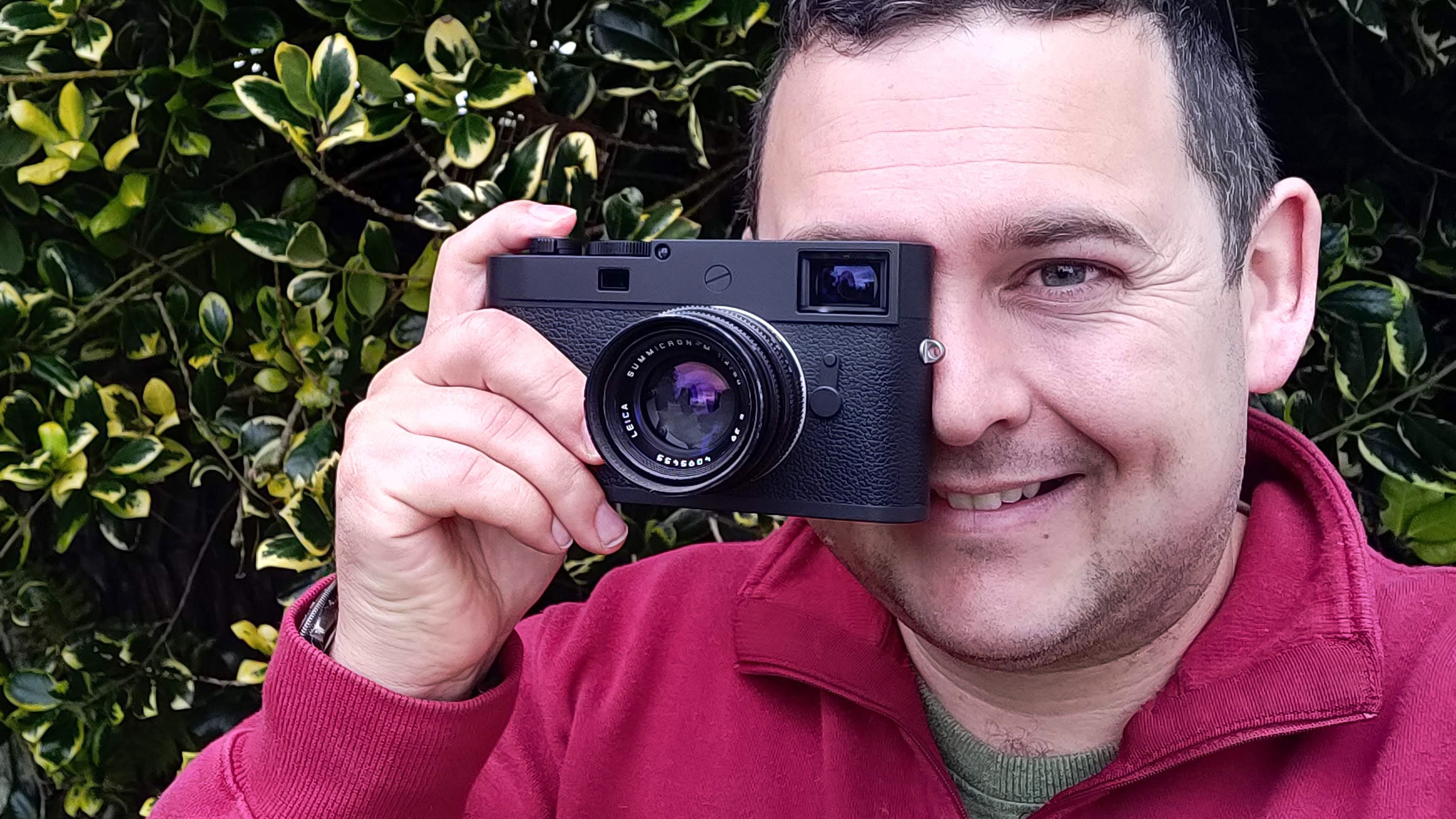 Sebastian Oakley holding a leica M11-D p to his eye