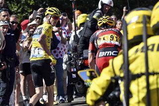 Chris Froome runs beside Richie Porte following a crash towards the end of Stage 12 of the 2016 Tour de France